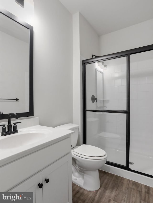76 Diving Scaup Rd, Hedgesville, WV 25427 - bathroom with vanity, a stall shower, and wood finished floors