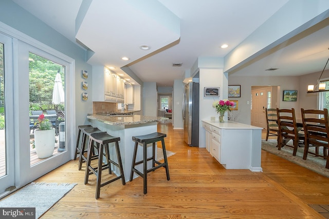 840 Old State Rd, Berwyn, PA 19312 - kitchen with a peninsula, healthy amount of natural light, light wood-style floors, and recessed lighting