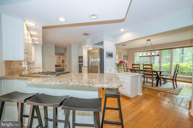 840 Old State Rd, Berwyn, PA 19312 - kitchen featuring stainless steel appliances, a peninsula, white cabinetry, light wood-style floors, and recessed lighting