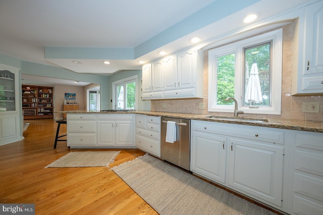 840 Old State Rd, Berwyn, PA 19312 - kitchen with dishwasher, a peninsula, white cabinetry, decorative backsplash, and light wood finished floors