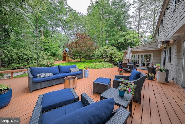 840 Old State Rd, Berwyn, PA 19312 - wooden terrace featuring an outdoor living space, outdoor dining area, a playground, and view of scattered trees