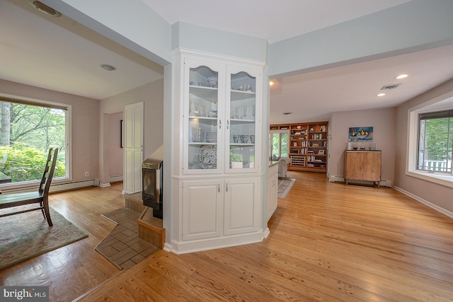 840 Old State Rd, Berwyn, PA 19312 - hallway with light wood-style floors, a baseboard heating unit, and recessed lighting