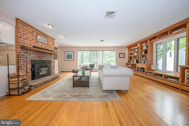 840 Old State Rd, Berwyn, PA 19312 - living room featuring wood finished floors and a fireplace
