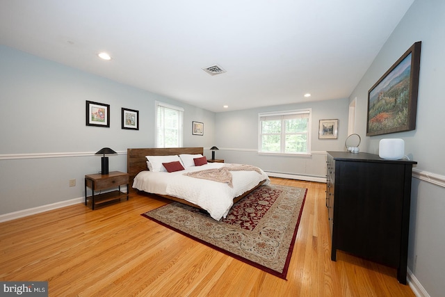 840 Old State Rd, Berwyn, PA 19312 - bedroom with baseboard heating, light wood-style floors, and recessed lighting
