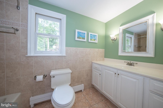 840 Old State Rd, Berwyn, PA 19312 - full bathroom with vanity, a baseboard radiator, tile patterned flooring, tile walls, and baseboard heating