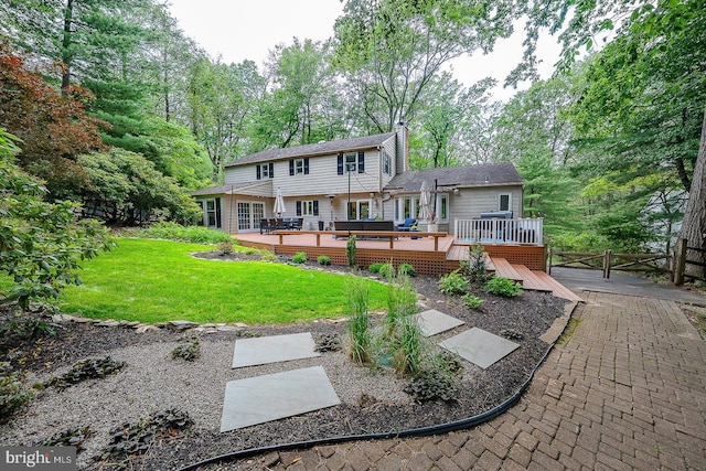 840 Old State Rd, Berwyn, PA 19312 - rear view of house featuring a chimney, a wooden deck, view of wooded area, and a gate