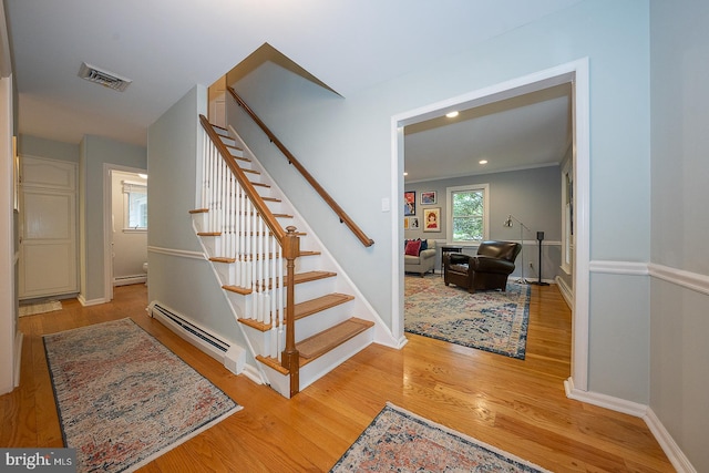 840 Old State Rd, Berwyn, PA 19312 - stairs with a baseboard radiator, wood finished floors, and recessed lighting