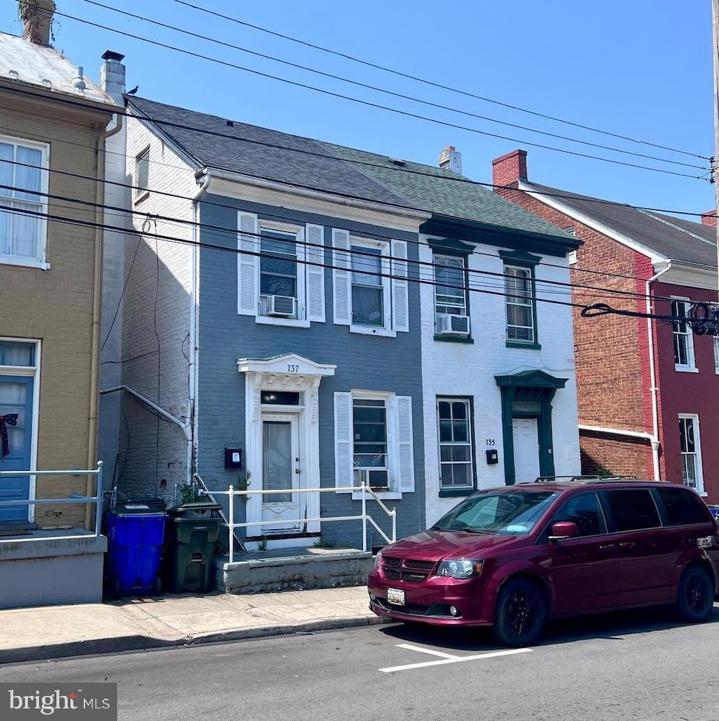 137 E Antietam St, Hagerstown, MD 21740 - view of front facade featuring brick siding and cooling unit