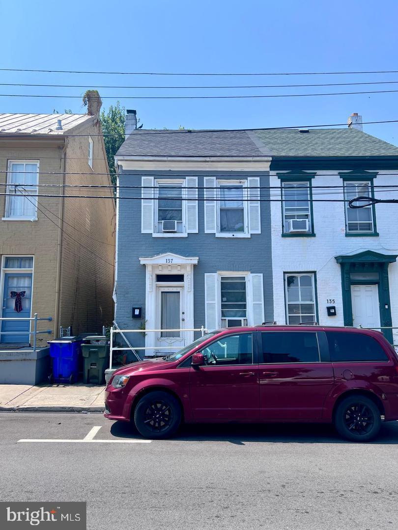 137 E Antietam St, Hagerstown, MD 21740 - view of front of property featuring brick siding and a chimney