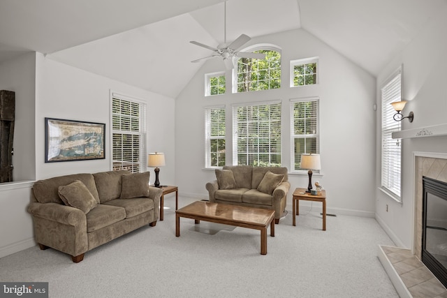 6 Shadybrook Rd, Mullica Hill, NJ 08062 - living room featuring a tiled fireplace, a ceiling fan, plenty of natural light, light colored carpet, and high vaulted ceiling
