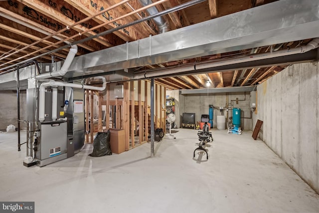 6 Shadybrook Rd, Mullica Hill, NJ 08062 - unfinished basement with heating unit, a water pressure tank, and electric panel