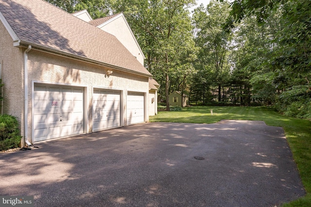 6 Shadybrook Rd, Mullica Hill, NJ 08062 - garage with driveway and view of scattered trees