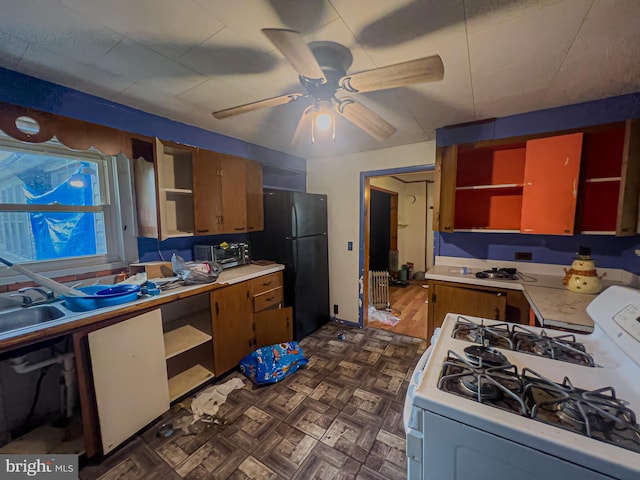 430 Bayard St, Kane, PA 16735 - kitchen with open shelves, gas range gas stove, freestanding refrigerator, light countertops, and ceiling fan