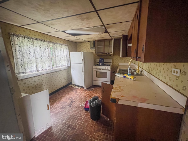 430 Bayard St, Kane, PA 16735 - kitchen with white appliances, wallpapered walls, brick patterned floors, a drop ceiling, and light countertops