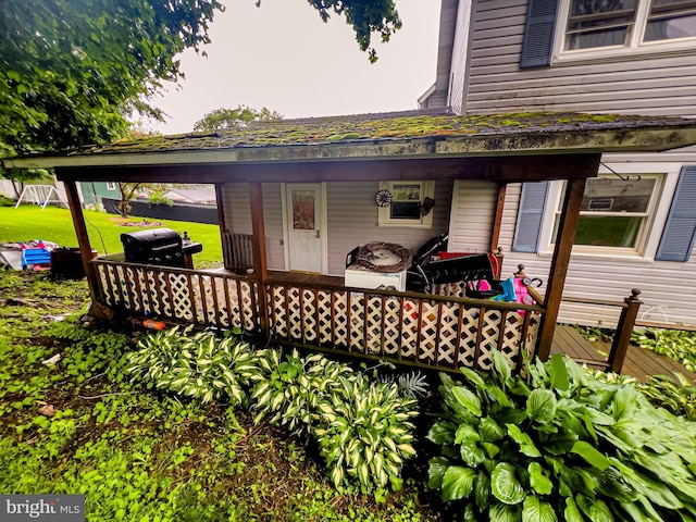 430 Bayard St, Kane, PA 16735 - wooden porch with a grill