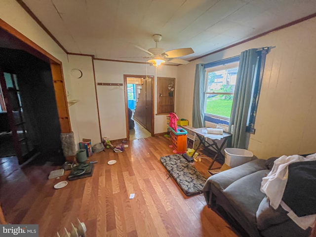 430 Bayard St, Kane, PA 16735 - living room featuring wood finished floors, a ceiling fan, and crown molding