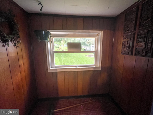430 Bayard St, Kane, PA 16735 - spare room with brick patterned flooring and wood walls