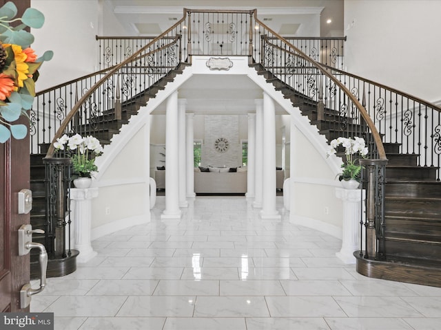 11509 Asbury Ridge Ct, Nokesville, VA 20181 - entryway with stairs, ornamental molding, marble look tile flooring, a towering ceiling, and ornate columns