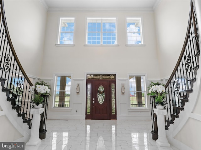 11509 Asbury Ridge Ct, Nokesville, VA 20181 - foyer entrance featuring a high ceiling, stairs, marble tiled floors, plenty of natural light, and ornamental molding