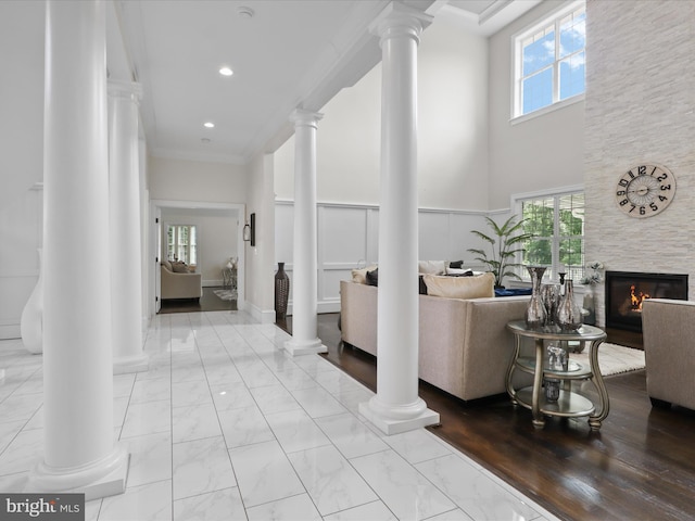 11509 Asbury Ridge Ct, Nokesville, VA 20181 - hall featuring light marble finish flooring, ornate columns, recessed lighting, a towering ceiling, and ornamental molding
