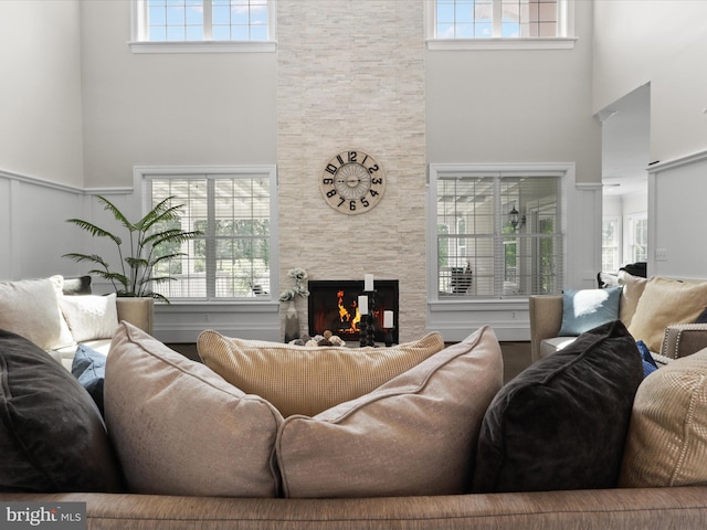 11509 Asbury Ridge Ct, Nokesville, VA 20181 - living area featuring a towering ceiling, a fireplace, and plenty of natural light