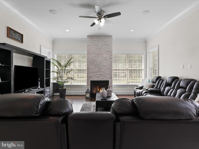 11509 Asbury Ridge Ct, Nokesville, VA 20181 - living room featuring a ceiling fan, wood finished floors, a stone fireplace, and ornamental molding