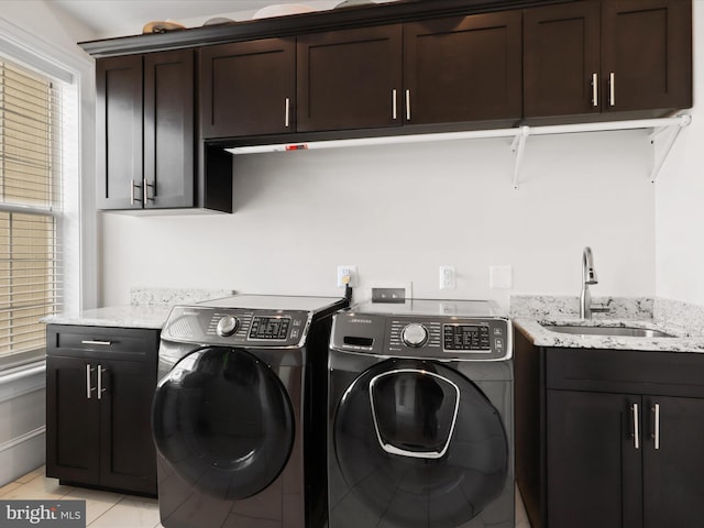 11509 Asbury Ridge Ct, Nokesville, VA 20181 - laundry area with washing machine and dryer, cabinet space, and light tile patterned flooring