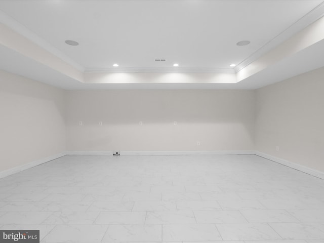 11509 Asbury Ridge Ct, Nokesville, VA 20181 - spare room with a tray ceiling, ornamental molding, recessed lighting, and light marble finish floors