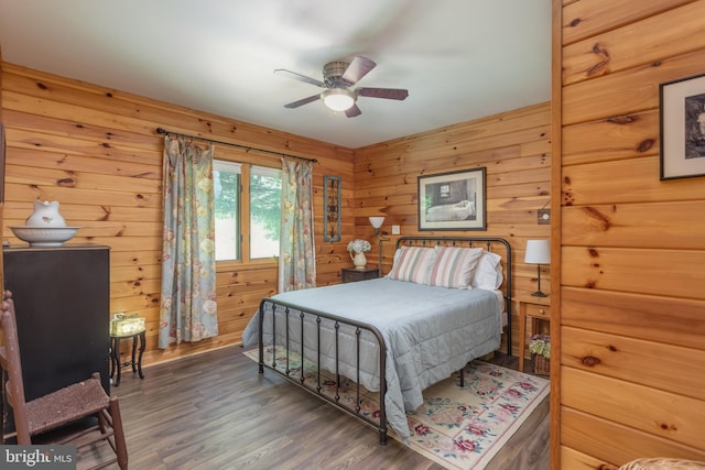 379 Wintergreen Way, Berkeley Springs, WV 25411 - bedroom with wood finished floors, wood walls, and ceiling fan