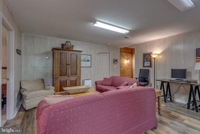 379 Wintergreen Way, Berkeley Springs, WV 25411 - living room featuring wood finished floors and wooden walls