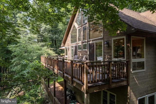 379 Wintergreen Way, Berkeley Springs, WV 25411 - rear view of property featuring a shingled roof and a deck