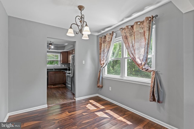 701 Hunters Run, Perkasie, PA 18944 - unfurnished dining area with dark wood-type flooring and a chandelier