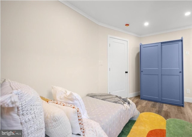 5717 Larchwood Ave, Philadelphia, PA 19143 - bedroom with wood finished floors, crown molding, and recessed lighting