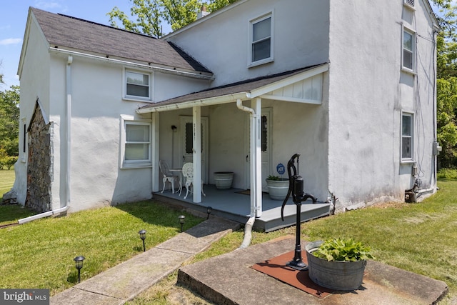 2397 Hill Rd, Perkiomenville, PA 18074 - view of front of house featuring stucco siding, a front lawn, and a shingled roof