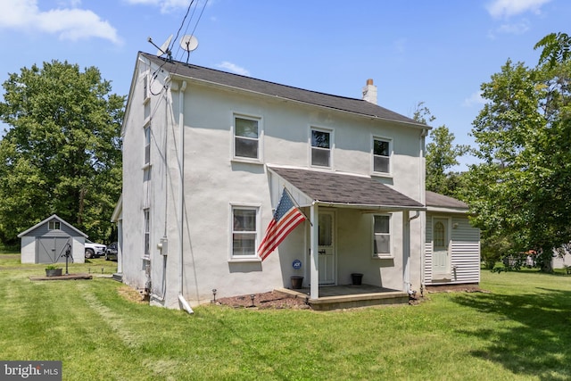 2397 Hill Rd, Perkiomenville, PA 18074 - back of house with stucco siding, a yard, a chimney, an outbuilding, and a shingled roof