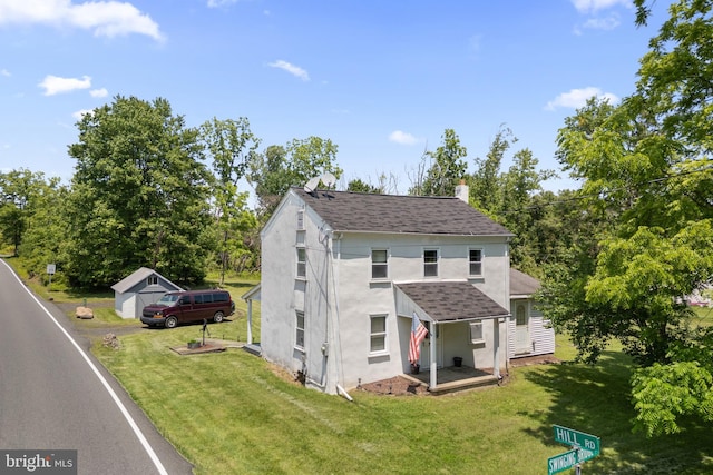 2397 Hill Rd, Perkiomenville, PA 18074 - traditional-style house with a shingled roof, a chimney, a front yard, and stucco siding