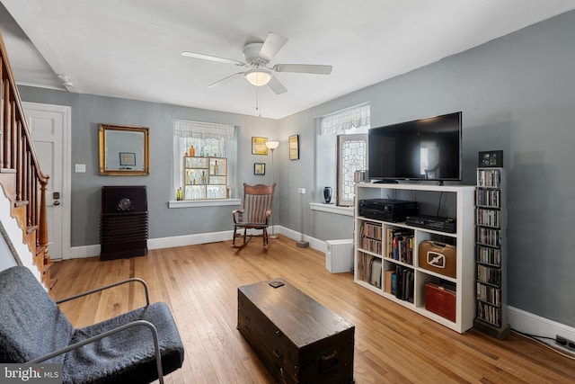 2397 Hill Rd, Perkiomenville, PA 18074 - living room with stairs, wood-type flooring, and a ceiling fan