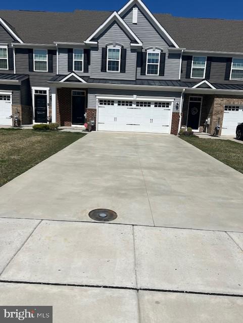 237 Hidden Acres Ln, Moorestown, NJ 08057 - townhome / multi-family property featuring concrete driveway, brick siding, an attached garage, and a standing seam roof