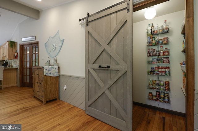 99 Old Main Shore Rd, Barnegat, NJ 08005 - interior space with a barn door and wood finished floors
