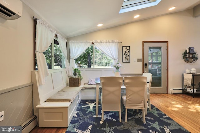 99 Old Main Shore Rd, Barnegat, NJ 08005 - dining area with a wall mounted air conditioner, a skylight, a baseboard heating unit, vaulted ceiling, and plenty of natural light