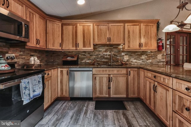 99 Old Main Shore Rd, Barnegat, NJ 08005 - kitchen with stainless steel appliances, lofted ceiling, dark wood-style floors, dark stone countertops, and backsplash