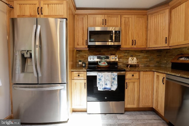 99 Old Main Shore Rd, Barnegat, NJ 08005 - kitchen featuring stainless steel appliances, dark stone countertops, decorative backsplash, and light wood finished floors