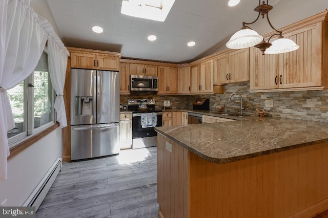 99 Old Main Shore Rd, Barnegat, NJ 08005 - kitchen with appliances with stainless steel finishes, a baseboard radiator, light wood finished floors, a peninsula, and dark stone counters