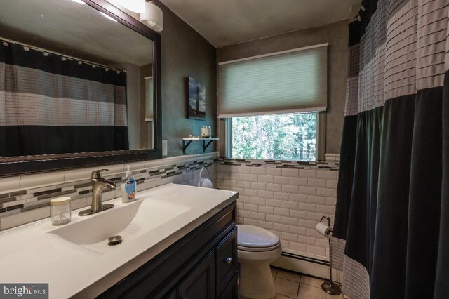 99 Old Main Shore Rd, Barnegat, NJ 08005 - bathroom featuring tile patterned flooring, tile walls, baseboard heating, vanity, and a wainscoted wall