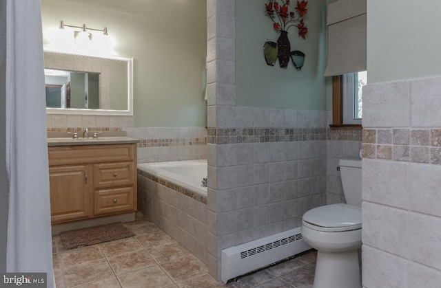 99 Old Main Shore Rd, Barnegat, NJ 08005 - full bathroom with a baseboard heating unit, a garden tub, vanity, tile walls, and tile patterned flooring