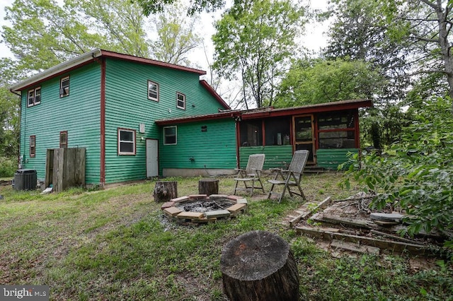99 Old Main Shore Rd, Barnegat, NJ 08005 - rear view of house featuring an outdoor fire pit and a sunroom