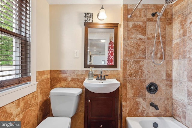 122 Carver Ave, Egg Harbor Township, NJ 08234 - bathroom with vanity, tile walls, shower / bathtub combination, and a wainscoted wall