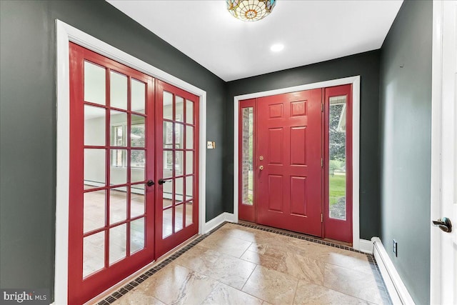 136 Schoolhouse Ln, Glen Mills, PA 19342 - foyer with french doors and a baseboard heating unit