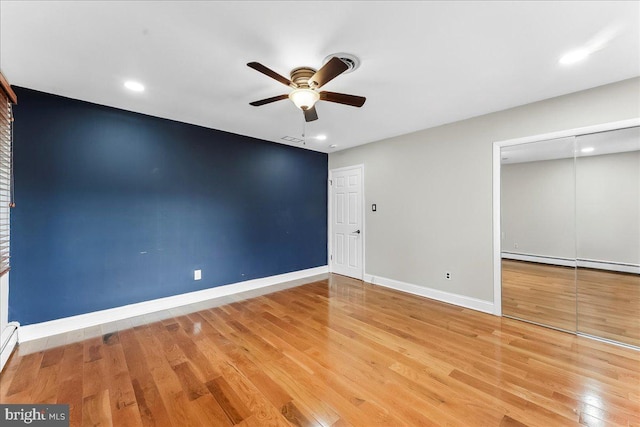 136 Schoolhouse Ln, Glen Mills, PA 19342 - unfurnished bedroom with wood finished floors, a baseboard radiator, recessed lighting, a ceiling fan, and a closet