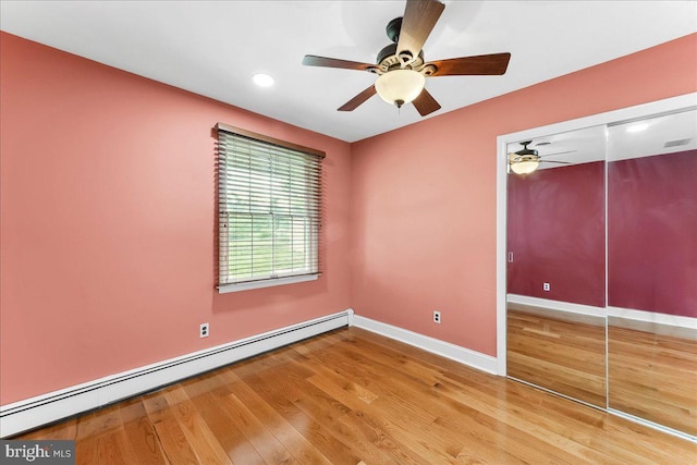 136 Schoolhouse Ln, Glen Mills, PA 19342 - unfurnished bedroom with a baseboard heating unit, wood finished floors, a closet, recessed lighting, and a ceiling fan